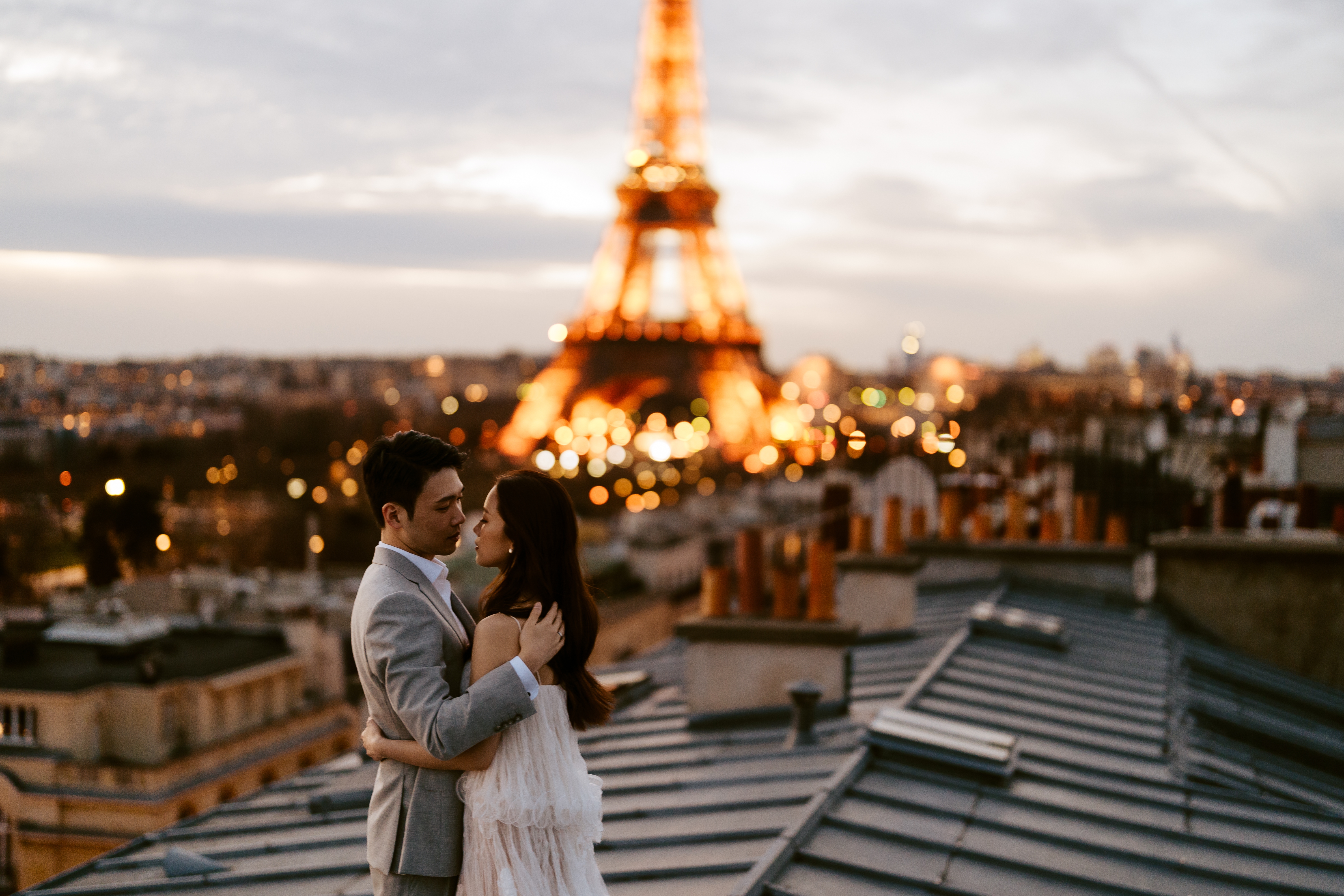 Couples Sunset Pre-wedding Photoshoot in Parisian rooftop with Eiffel tower view