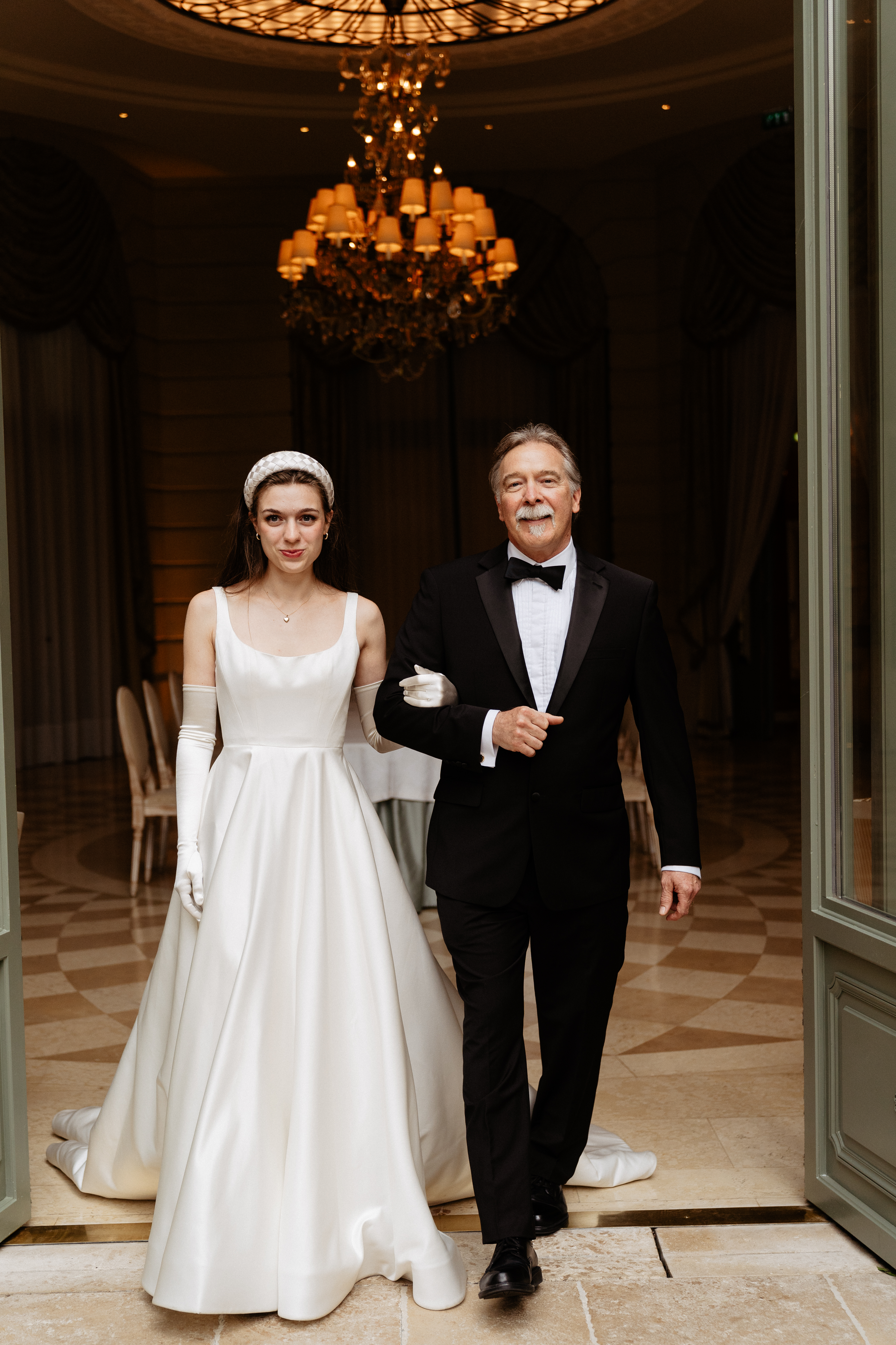 Destination wedding elopement at the luxurious Ritz Paris bride walking with dad 