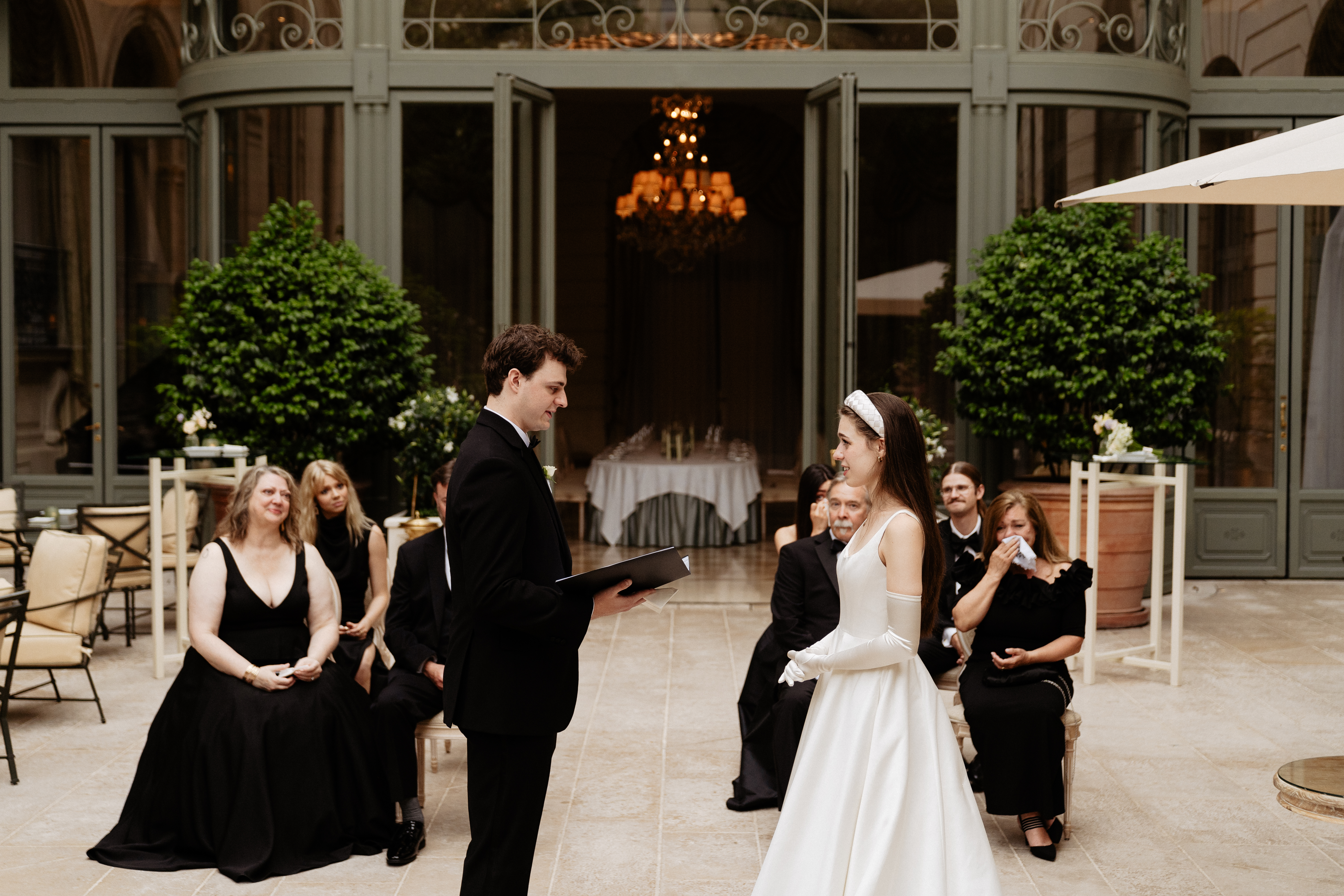 Destination wedding elopement at the luxurious Ritz Paris garden ceremony reading vows 