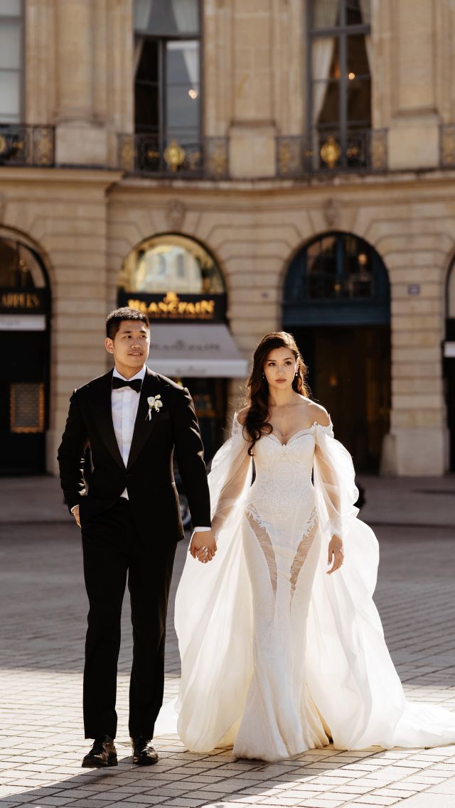 In the heart of Paris, where elegance meets timeless romance, they stride. 🖤 She, adorned in a daring Galia Lahav masterpiece, redefines bridal coolness. He, the epitome of sophistication in his classic black tux. Together, hand in hand, they conquer Paris, where love and luxury intertwine. ✨  Congrats @nataliatymoo and HB 🎉❤️‍🔥  Photos & video by @throughtheglassparis 
Wedding dress @galialahav @theivorybridal @glbrides 
MUAH @alesiasolo_muah